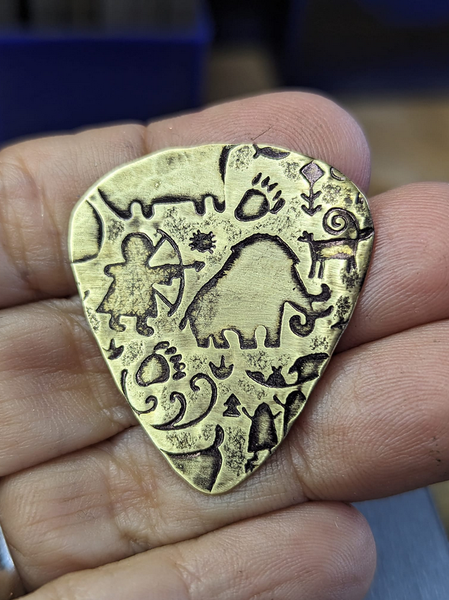 Caveman brass guitar pick – Nici's Picks