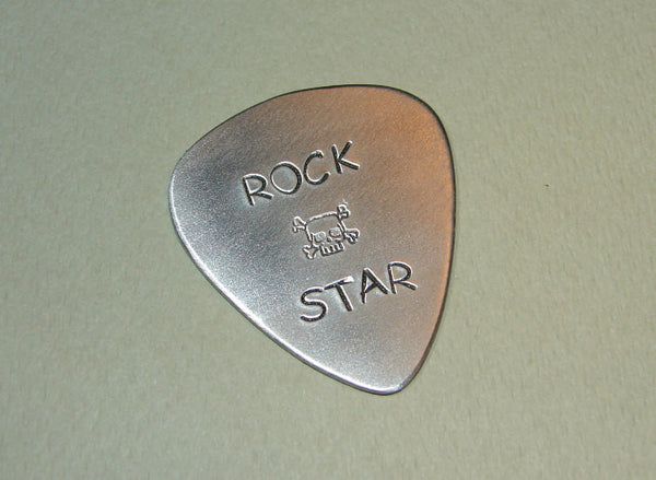 Sterling Guitar Pick Handmade with Rock Star and Skull Stamps – Nici's ...